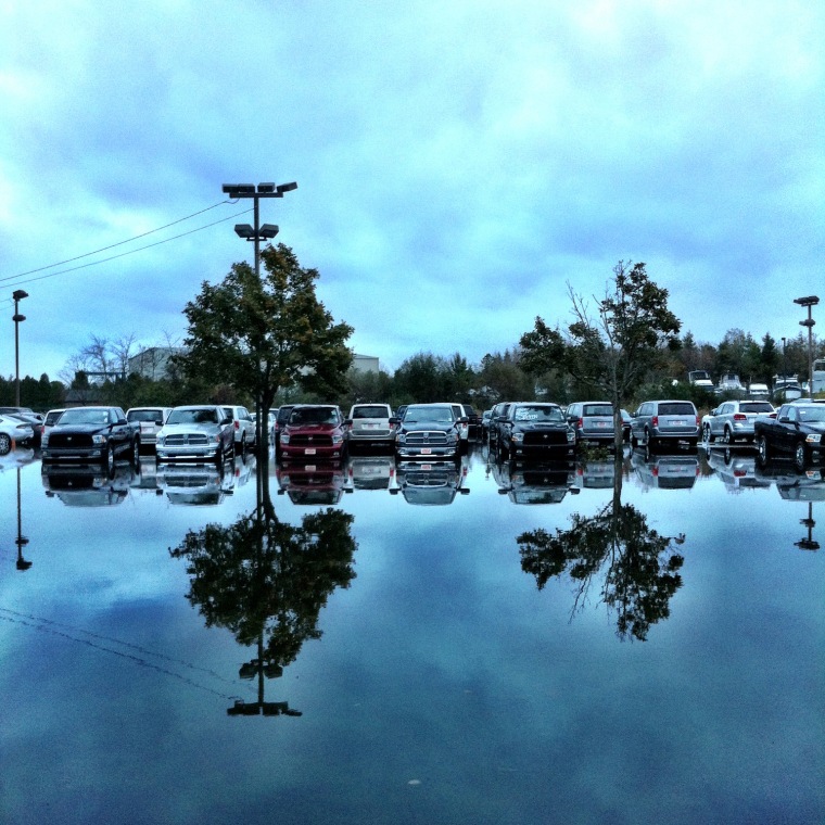 An auto dealer lay partially submerged in the aftermath of Hurricane Sandy's wrath, which produced an unprecedented storm surge along the coast of New Jersey, on October 30, 2012.